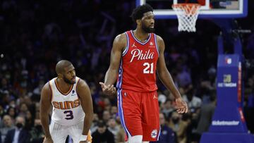 PHILADELPHIA, PENNSYLVANIA - FEBRUARY 08: Chris Paul #3 of the Phoenix Suns and Joel Embiid #21 of the Philadelphia 76ers look on during the third quarter at Wells Fargo Center on February 08, 2022 in Philadelphia, Pennsylvania. NOTE TO USER: User expressly acknowledges and agrees that, by downloading and or using this photograph, User is consenting to the terms and conditions of the Getty Images License Agreement.   Tim Nwachukwu/Getty Images/AFP
 == FOR NEWSPAPERS, INTERNET, TELCOS &amp; TELEVISION USE ONLY ==