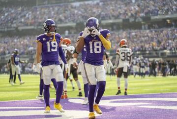 Oct 3, 2021; Minneapolis, Minnesota, USA; Minnesota Vikings wide receiver Adam Thielen (19) congratulates wide receiver Justin Jefferson (18) who is celebrating a touchdown reception from quarterback Kirk Cousins (8) against the Cleveland Browns in the fi