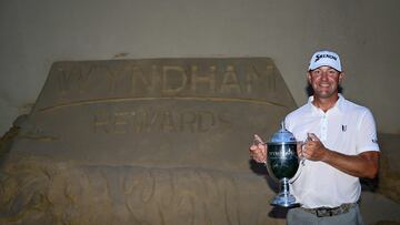 GREENSBORO, NORTH CAROLINA - AUGUST 06: Lucas Glover of the United States poses with the championship trophy after winning the Wyndham Championship at Sedgefield Country Club on August 06, 2023 in Greensboro, North Carolina.   Logan Whitton/Getty Images/AFP (Photo by Logan Whitton / GETTY IMAGES NORTH AMERICA / Getty Images via AFP)