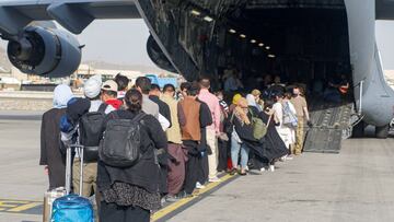 FILE PHOTO: Evacuees assemble before boarding a C-17 Globemaster III during an evacuation at Hamid Karzai International Airport, Afghanistan, August 18, 2021. Picture taken August 18, 2021. U.S. Marine Corps/Lance Cpl. Nicholas Guevara/Handout via REUTERS