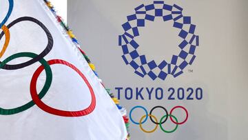 The Olympic flag (L) and the logo of the Tokyo 2020 are displayed during the official flag arrival ceremony at the Tokyo&#039;s Haneda airport on August 24, 2016. - The Olympic flag arrived in Tokyo on August 24, as Japan&#039;s capital gears up to host t