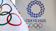 The Olympic flag (L) and the logo of the Tokyo 2020 are displayed during the official flag arrival ceremony at the Tokyo&#039;s Haneda airport on August 24, 2016. - The Olympic flag arrived in Tokyo on August 24, as Japan&#039;s capital gears up to host t