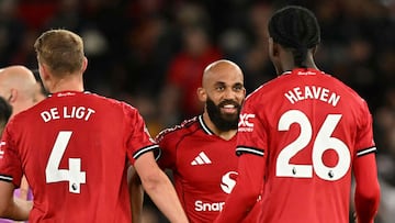 Manchester United's Cameroonian midfielder #19 Bryan Mbeumo (C) celebrates at the end of the English Premier League football match between Manchester United and Brighton and Hove Albion at Old Trafford in Manchester, north west England, on October 25, 2025. (Photo by Oli SCARFF / AFP) / RESTRICTED TO EDITORIAL USE. No use with unauthorized audio, video, data, fixture lists, club/league logos or 'live' services. Online in-match use limited to 120 images. An additional 40 images may be used in extra time. No video emulation. Social media in-match use limited to 120 images. An additional 40 images may be used in extra time. No use in betting publications, games or single club/league/player publications. /