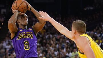 December 25, 2018; Oakland, CA, USA; Los Angeles Lakers guard Rajon Rondo (9) shoots the basketball against Golden State Warriors forward Jonas Jerebko (21) during the first quarter at Oracle Arena. Mandatory Credit: Kyle Terada-USA TODAY Sports