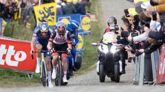 Dutch Mathieu van der Poel of Alpecin-Fenix and Slovenian Tadej Pogacar of UAE Team Emirates compete at the Paterberg cobbles climb in Kluisbergen, during the men's race of the 'Ronde van Vlaanderen - Tour des Flandres - Tour of Flanders' one day cycling 