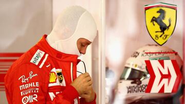 SUZUKA, JAPAN - OCTOBER 06: Sebastian Vettel of Germany and Ferrari prepares to drive in the garage during qualifying for the Formula One Grand Prix of Japan at Suzuka Circuit on October 6, 2018 in Suzuka.  (Photo by Mark Thompson/Getty Images)