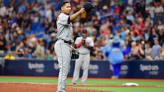 ST PETERSBURG, FLORIDA - SEPTEMBER 01: Carlos Carrasco #59 of the Cleveland Indians tips hit hat to manager Terry Francona #77 before the seventh inning during action against the Tampa Bay Rays at Tropicana Field on September 01, 2019 in St Petersburg, Florida.   Julio Aguilar/Getty Images/AFP
 == FOR NEWSPAPERS, INTERNET, TELCOS &amp; TELEVISION USE ONLY ==