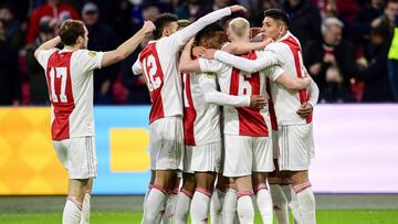 Ajax's players celebrate the team's second goal during the Dutch Eredivisie match between Ajax Amsterdam and FC Twente at the Johan Cruijff Arena in Amsterdam on February 13, 2022. (Photo by Olaf Kraak / ANP / AFP) / Netherlands OUT