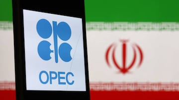 OPEC logo displayed on a phone screen and Iranian flag displayed on a screen in the background are seen in this illustration photo taken in Poland on October 6, 2022. (Photo by Jakub Porzycki/NurPhoto via Getty Images)