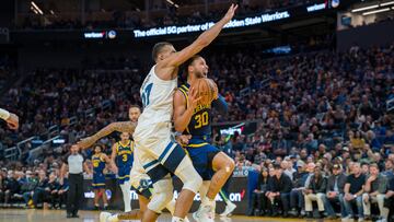 Mar 26, 2023; San Francisco, California, USA; Golden State Warriors guard Stephen Curry (30) drives to the net against Minnesota Timberwolves center Rudy Gobert (27) during the third quarter at Chase Center. Mandatory Credit: Neville E. Guard-USA TODAY Sports