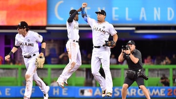 MIAMI, FL - AUGUST 14: Giancarlo Stanton #27 of the Miami Marlins celebrates with Dee Gordon #9 after defeating the San Francisco Giants at Marlins Park on August 14, 2017 in Miami, Florida. Eric Espada/Getty Images/AFP
== FOR NEWSPAPERS, INTERNET, TELCOS & TELEVISION USE ONLY ==