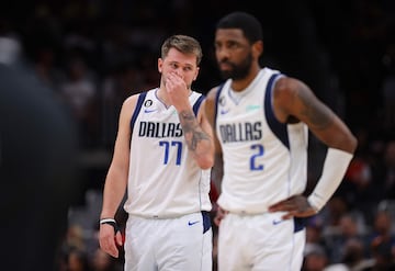 Luka Doncic and Kyrie Irving of the Dallas Mavericks react against the Atlanta Hawks at State Farm Arena on April 02, 2023 in Atlanta, Georgia.