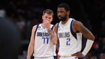 Luka Doncic #77 and Kyrie Irving #2 of the Dallas Mavericks react against the Atlanta Hawks during the second quarter at State Farm Arena on April 02, 2023 in Atlanta, Georgia.