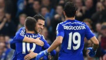 LONDON, ENGLAND - NOVEMBER 22:  Cesc Fabregas of Chelsea hugs Eden Hazard of Chelsea after he scored their second goal during the Barclays Premier League match between Chelsea and West Bromwich Albion at Stamford Bridge on November 22, 2014 in London, England.  (Photo by Tom Dulat/Getty Images)