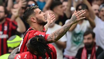 AC Milan's French defender Theo Hernandez (Top) celebrates with AC Milan's Portuguese forward Rafael Leao a goal during the Italian Serie A football match between AC Milan and Atalanta Bergamo at the San Siro stadium in Milan on May 15, 2022. (Photo by MIGUEL MEDINA / AFP) (Photo by MIGUEL MEDINA/AFP via Getty Images)