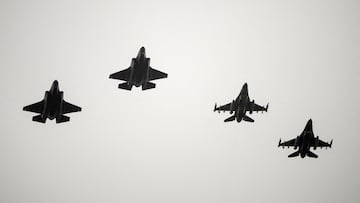 FILE PHOTO: Two F-16 and two F-35 fighter jets return to air base Flyvestation Skrydstrup after patrolling around Denmark at low altitude, as the Danish air base officially receives four F-35 fighter jets on October 1, 2023. Ritzau Scanpix/Bo Amstrup via REUTERS ATTENTION EDITORS - THIS IMAGE WAS PROVIDED BY A THIRD PARTY. DENMARK OUT. NO COMMERCIAL OR EDITORIAL SALES IN DENMARK./File Photo