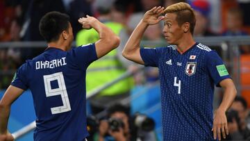 YEKATERINBURG, RUSSIA - JUNE 24:  Keisuke Honda of Japan celebrates with team mate Shinji Okasaki after equalising during the 2018 FIFA World Cup Russia group H match between Japan and Senegal at Ekaterinburg Arena on June 24, 2018 in Yekaterinburg, Russia.  (Photo by Mike Hewitt - FIFA/FIFA via Getty Images)