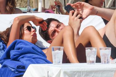 The Real Madrid and Belgium goalkeeper is recharging his batteries on the beaches of the Spanish island Ibiza.