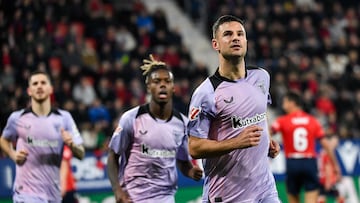 Athletic Bilbao's Spanish forward #12 Gorka Guruzeta (R) celebrates after scoring their first goal during the Spanish league football match between CA Osasuna and Athletic Club Bilbao at El Sadar stadium in Pamplona on December 21, 2024. (Photo by ANDER GILLENEA / AFP)