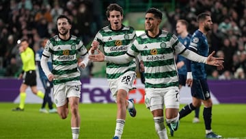 Celtic's Honduras striker #07 Luis Palma (L) celebrates after scoring his team first goal during the UEFA Champions League group E football match between Celtic and Feyenoord at Celtic Park stadium in Glasgow on December 13, 2023. (Photo by ANDY BUCHANAN / AFP)