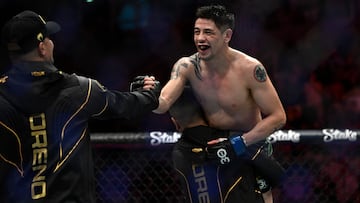 Mexican Brandon Moreno celebrates after defeating Brazilian Deiveson Figueiredo during their flyweight title bout at the Ultimate Fighting Championship (UFC) event at the Jeunesse Arena in Rio de Janeiro, Brazil, on January 21, 2023. (Photo by MAURO PIMENTEL / AFP)