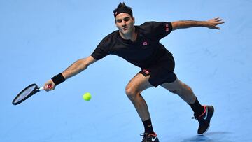 Switzerland's Roger Federer returns against Serbia's Novak Djokovic during their men's singles round-robin match on day five of the ATP World Tour Finals tennis tournament at the O2 Arena in London on November 14, 2019. (Photo by Ben STANSALL / AFP)