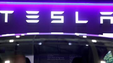 FILE PHOTO: The logo of Tesla on display at the Everything Electric exhibition at the ExCeL London international exhibition and convention centre in London, Britain, March 28, 2024. REUTERS/Peter Cziborra/File Photo