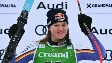 Winner Germany's Emma Aicher celebrates on the podium after the women's super G race, part of the FIS Alpine Ski World Cup 2025-2026 in Soldeu on February 28, 2026. (Photo by Lionel BONAVENTURE / AFP)