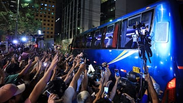 Fans wave to the bus as Lionel Messi and the Inter Miami football team arrive at a hotel in Lima on January 28, 2025. (Photo by Connie CALDERON / AFP)