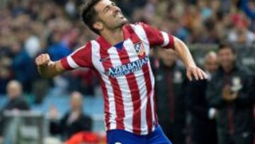 Villa celebra un gol en su etapa en el Atleti.