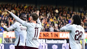 (L-R) Ajax' Burkinabe forward #20 Bertrand Traore congratulates Ajax's Belgian Forward #11 Mika Godts as they celebrate the team's second goal during the Dutch Eredivisie football match between RKC Waalwijk and AFC Ajax at Mandemakers Stadium, in Waalwijk on September 29, 2024. (Photo by Olaf Kraak / ANP / AFP) / Netherlands OUT