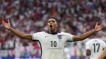 England's midfielder #10 Jude Bellingham celebrates scoring his team's first goal during the UEFA Euro 2024 round of 16 football match between England and Slovakia at the Arena AufSchalke in Gelsenkirchen on June 30, 2024. (Photo by Adrian DENNIS / AFP)