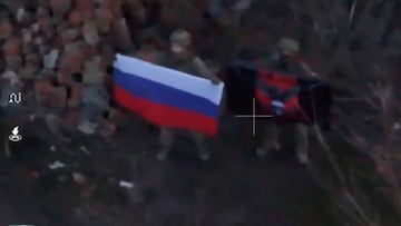 A soldier holds up a Russian flag in Kurakhove, Donetsk Region, Ukraine in this screen grab taken from a social media video released on January 5, 2025, obtained by Reuters. Social Media/via REUTERS THIS IMAGE HAS BEEN SUPPLIED BY A THIRD PARTY. NO RESALES. NO ARCHIVES.