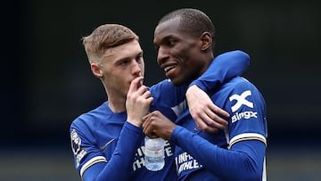 Chelsea's English midfielder #20 Cole Palmer (L) and Chelsea's Senegalese striker #15 Nicolas Jackson react following the English Premier League football match between Chelsea and West Ham United at Stamford Bridge in London on May 5, 2024. Chelsea won the match 5-0. (Photo by HENRY NICHOLLS / AFP) / RESTRICTED TO EDITORIAL USE. No use with unauthorized audio, video, data, fixture lists, club/league logos or 'live' services. Online in-match use limited to 120 images. An additional 40 images may be used in extra time. No video emulation. Social media in-match use limited to 120 images. An additional 40 images may be used in extra time. No use in betting publications, games or single club/league/player publications. / 