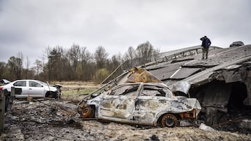 Kyiv (Ukraine), 16/04/2022.- A man stands on a damaged bridge in Kyiv area, Ukraine, 16 April 2022. Russian troops entered Ukraine on 24 February resulting in fighting and destruction in the country, and triggering a series of severe economic sanctions on