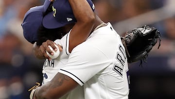 ST PETERSBURG, FLORIDA - OCTOBER 03: Randy Arozarena #56 of the Tampa Bay Rays hugs his mother, Sandra Gonzalez, after her ceremonial first pitch prior to during Game One of the Wild Card Series between the Tampa Bay Rays and the Texas Rangers at Tropicana Field on October 03, 2023 in St Petersburg, Florida.   Megan Briggs/Getty Images/AFP (Photo by Megan Briggs / GETTY IMAGES NORTH AMERICA / Getty Images via AFP)