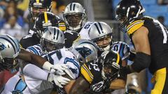 Sep 1, 2016; Charlotte, NC, USA; Pittsburgh Steelers running back Fitzgerald Toussaint (33) breaks through the Carolina Panthers defense during the first half of the game at Bank of America Stadium. Mandatory Credit: Sam Sharpe-USA TODAY Sports