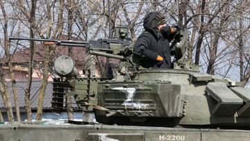 A service member of pro-Russian troops in uniform without insignia is seen atop of a tank during Ukraine-Russia conflict in the besieged southern port city of Mariupol, Ukraine March 18, 2022. REUTERS/Alexander Ermochenko