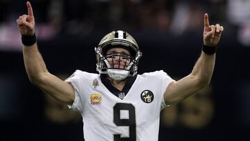 (FILES) In this file photo taken on October 8, 2018 Drew Brees #9 of the New Orleans Saints reacts after throwing a 62 yard pass to take the all time yardage record against the Washington Redskins at Mercedes-Benz Superdome in New Orleans, Louisiana. - New Orleans Saints quarterback Drew Brees set the NFL all-time passing yardage record on Monday, breaking Peyton Manning&#039;s old mark on a 62-yard touchdown pass in a 43-19 victory over Washington. Brees completed 26-of-29 passes for 363 yards and three touchdowns to spark the Saints&#039; victory, overtaking Manning for the career mark with a scoring toss to Tre&#039;Quan Smith down the right sideline with 2:36 remaining in the second quarter.&quot;I will remember that one for a long time,&quot; Brees said. (Photo by Chris Graythen / GETTY IMAGES NORTH AMERICA / AFP)