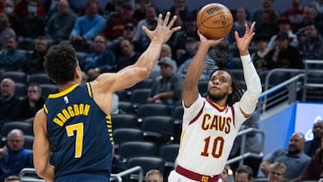 Mar 8, 2022; Indianapolis, Indiana, USA; Cleveland Cavaliers guard Darius Garland (10) shoots the ball while Indiana Pacers guard Malcolm Brogdon (7) defends in the first half at Gainbridge Fieldhouse. Mandatory Credit: Trevor Ruszkowski-USA TODAY Sports