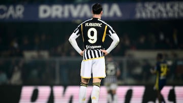 Juventus' Serbian forward #09 Dusan Vlahovic reacts during the Italian Serie A football match between Hellas Verona and Juventus at the Marcantonio Bentegodi stadium in Verona on February 17, 2024. (Photo by MARCO BERTORELLO / AFP)