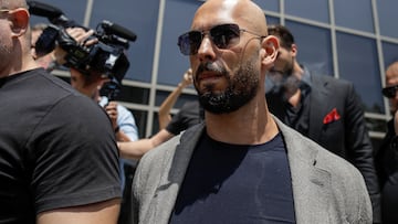 Andrew Tate, escorted by bodyguards, leaves the Bucharest Tribunal in Bucharest, Romania, June 21, 2023. Inquam Photos/Octav Ganea via REUTERS ATTENTION EDITORS - THIS IMAGE WAS PROVIDED BY A THIRD PARTY. ROMANIA OUT. NO COMMERCIAL OR EDITORIAL SALES IN ROMANIA
