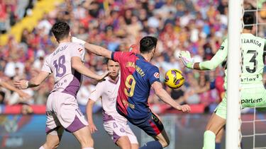 Barcelona's Polish forward #09 Robert Lewandowski scores his team's second goal during the Spanish league football match between FC Barcelona and Girona FC at the Estadi Olimpic Lluis Companys in Barcelona on March 30, 2025. (Photo by LLUIS GENE / AFP)