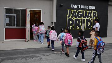 Students arrive for the first day of school, as teachers and volunteers patrol for the presence of Immigration and Customs Enforcement (ICE), at the Ninety-Third Street Elementary School, in Los Angeles, California, U.S., August 14, 2025. REUTERS/Daniel Cole