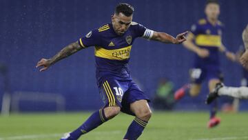 Carlos Tevez of Argentina&#039;s Boca Juniors scores his side&#039;s third goal during a Copa Libertadores Group H against Venezuela&#039;s Caracas FC soccer match at the Bombonera stadium in Buenos Aires, Argentina, Thursday, Oct. 22, 2020. (Juan Ignacio Roncoroni/Pool via AP)