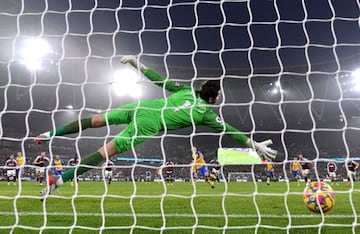 LONDON, ENGLAND - DECEMBER 26: James Ward-Prowse of Southampton scores their side's second goal from the penalty spot past Lukasz Fabianski of West Ham United during the Premier League match between West Ham United and Southampton at London Stadium on December 26, 2021 in London, England. (Photo by Justin Setterfield/Getty Images)