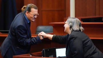 Actor Johnny Depp greets courtroom staff after closing arguments at the Fairfax County Circuit Courthouse in Fairfax, Virginia.