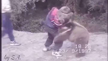 9-year-old Khabib playfully wrestles with a bear cub