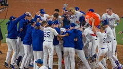 The Texas Rangers gather to celebrate at home plate