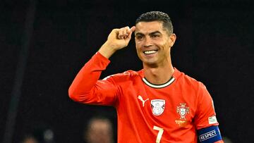 Portugal's forward #07 Cristiano Ronaldo (R) celebrates after scoring the 1-2 penalty goal as Hungary's midfielder #17 Callum Styles reacts during the 2026 World Cup qualifiers Europe zone group F football match between Hungary and Portugal on September 9, 2025 in Budapest, Hungary. (Photo by Attila KISBENEDEK / AFP)